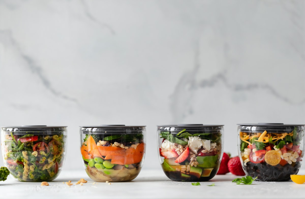 Fresh vegetables and cooking ingredients on a wooden counter